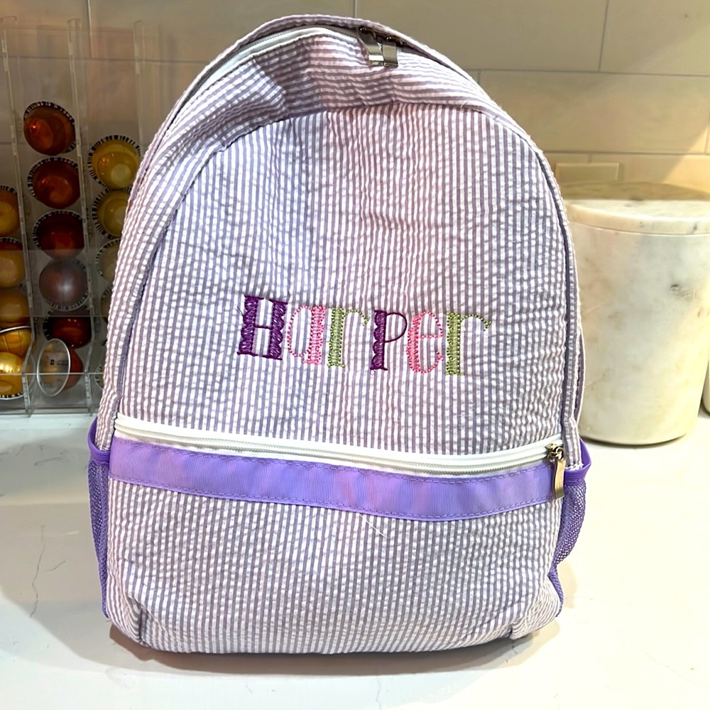 Backpack with name Harper embroidered on the front. Only used for a month!